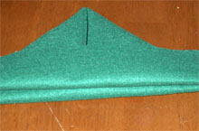 Green felt folded into the basic triangular Edelweiss hat shape
