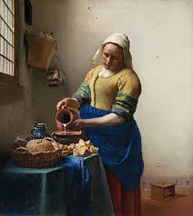 Vermeer's The Milkmaid, a woman pouring milk in a kitchen