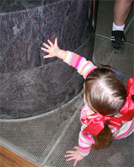 megan checking out a stone fountain megan checking out a stone fountain